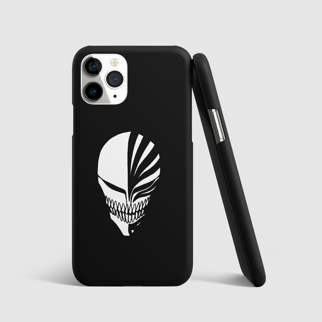 Minimalist artwork of Ichigo Kurosaki’s Hollow mask from "Bleach" on phone cover.