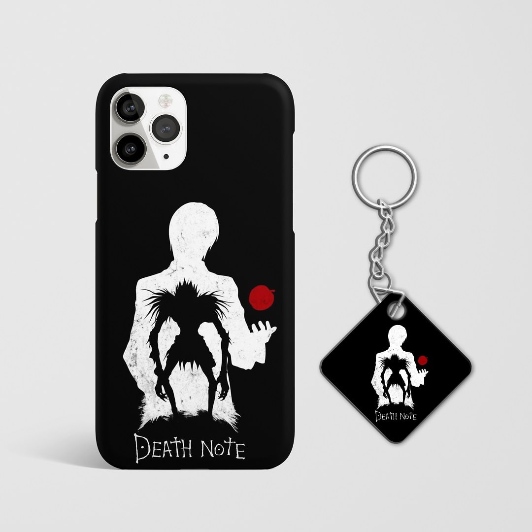 Close-up of the apple symbol associated with Ryuk on phone case with Keychain.