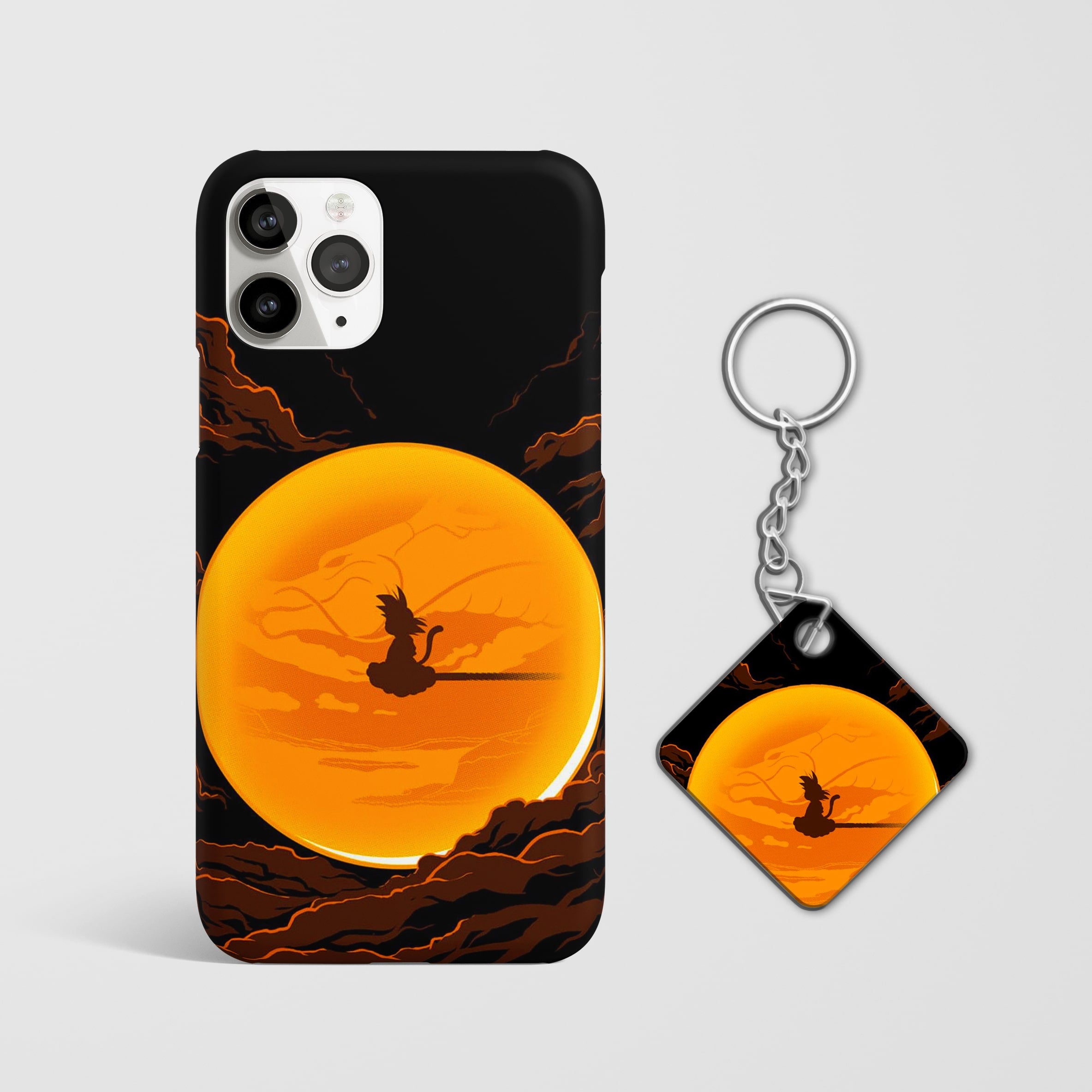 Close-up of Gohan and Nimbus illustration on phone case with Keychain.