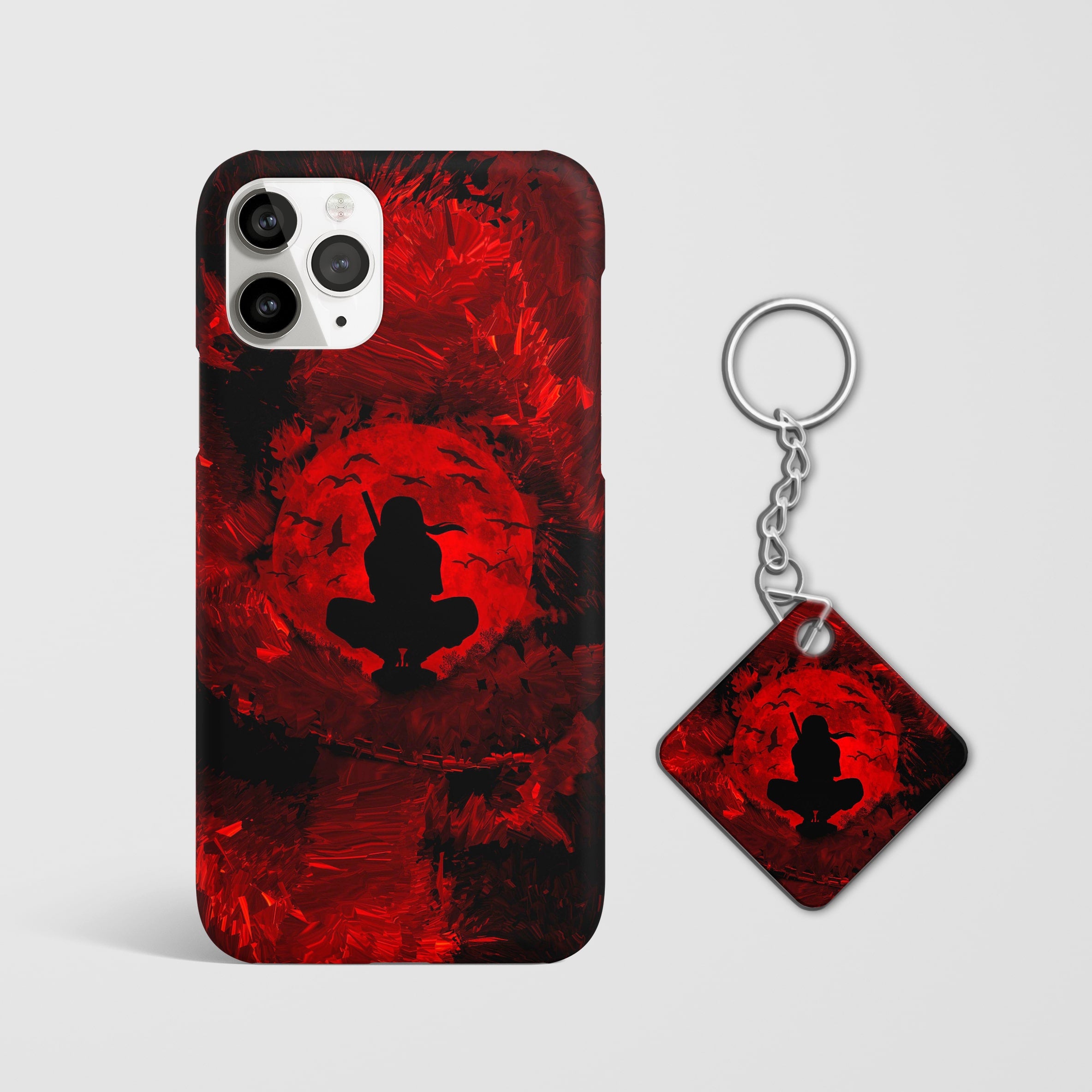 Close-up of the Sasuke Uchiha Red Moon Phone Cover, highlighting the detailed 3D matte design with keychain.